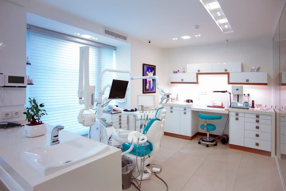 Smiling patient relaxing in a dental treatment chair